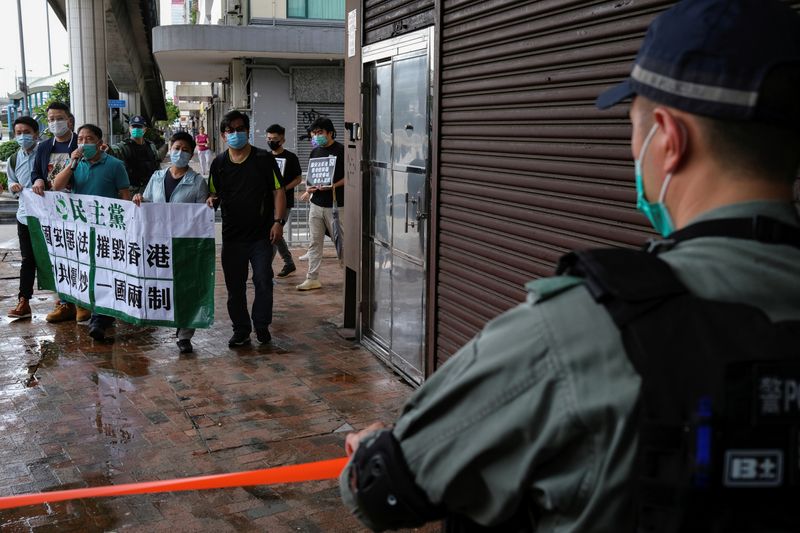 Activists march against new security laws, near China’s Liaison Office,