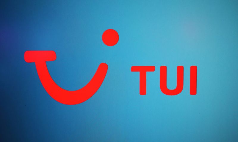 The TUI logo is displayed on a computer screen in