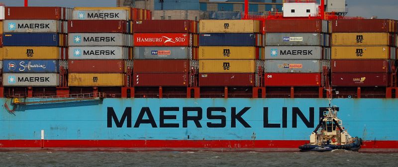 The Maersk Line container ship Maersk Sentosa is helped by