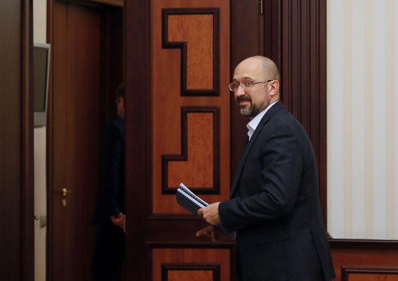 Ukraine’s Prime Minister Shmygal leaves after an interview in Kiev
