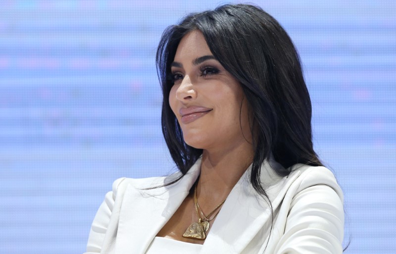 Reality TV personality Kim Kardashian attends a public discussion during