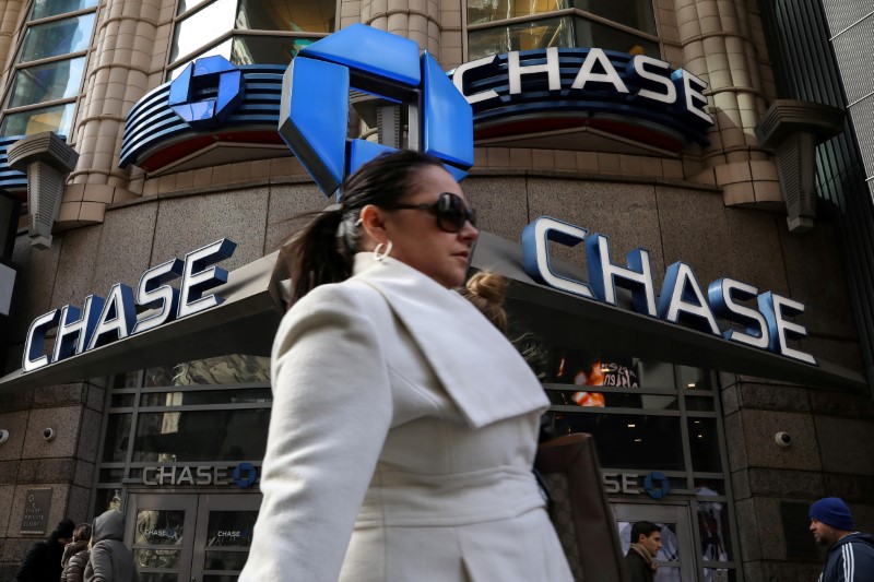FILE PHOTO: A woman passes by a Chase bank in