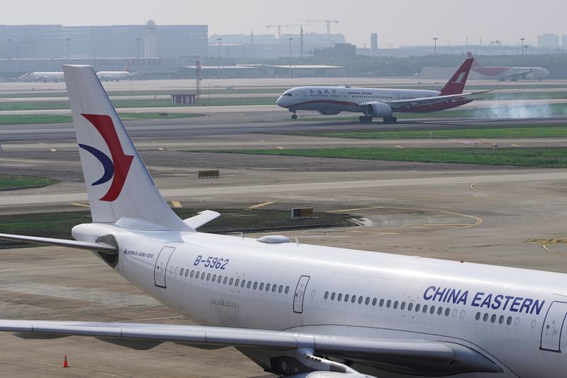 FILE PHOTO: A China Eastern Airlines aircraft and a Shanghai