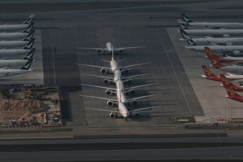 Cathay Pacific aircraft are seen parked on the tarmac at