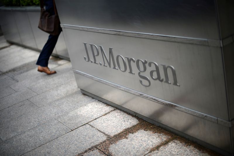 A man walks into the JP Morgan headquarters at Canary