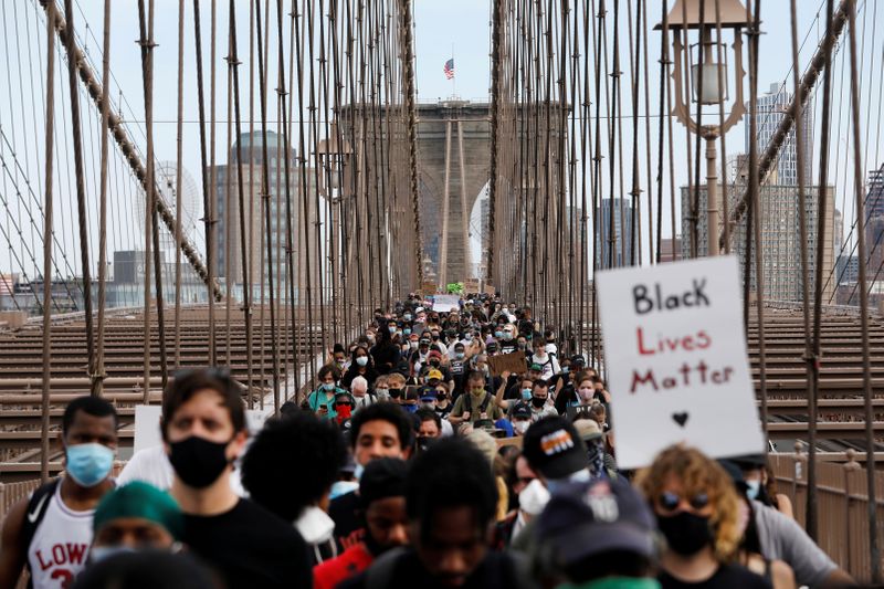 Demonstrators march across Brooklyn Bridge against the death in Minneapolis