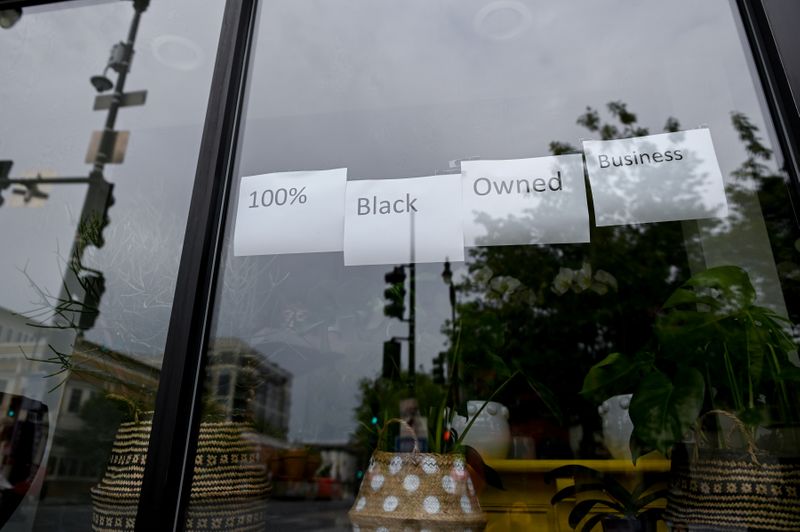 FILE PHOTO: Lee’s Flower Shop posts signs in its windows