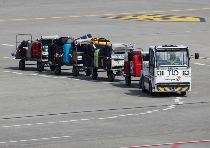 Luggage stored on trolleys is transported by air service provider
