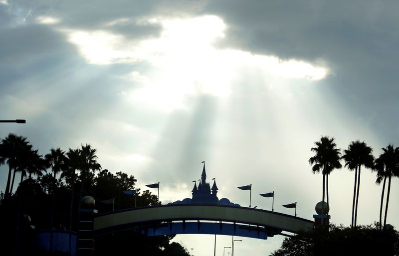 FILE PHOTO: Sunlight breaks through clouds near Disney World ahead