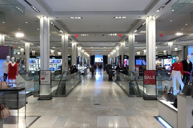 People shop at Macy’s Herald Square store on the first
