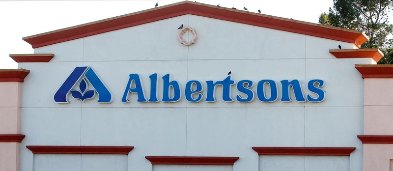 FILE PHOTO: Birds perch upon signage for an Albertsons grocery