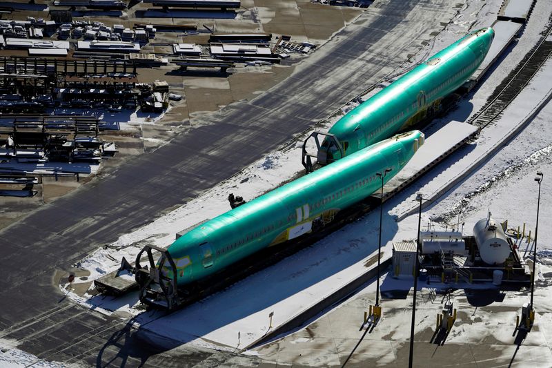 Airplane fuselages bound for Boeing’s 737 Max production facility await