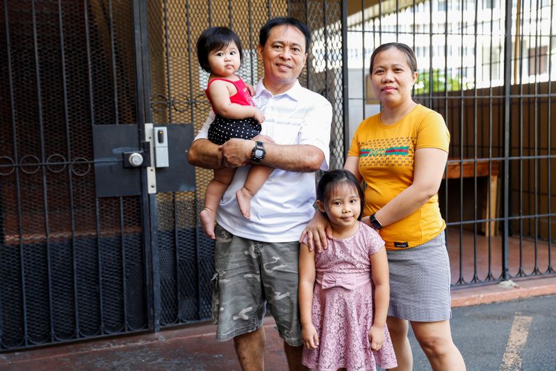 Judith and Jose Ramirez pose with their daughters outside their