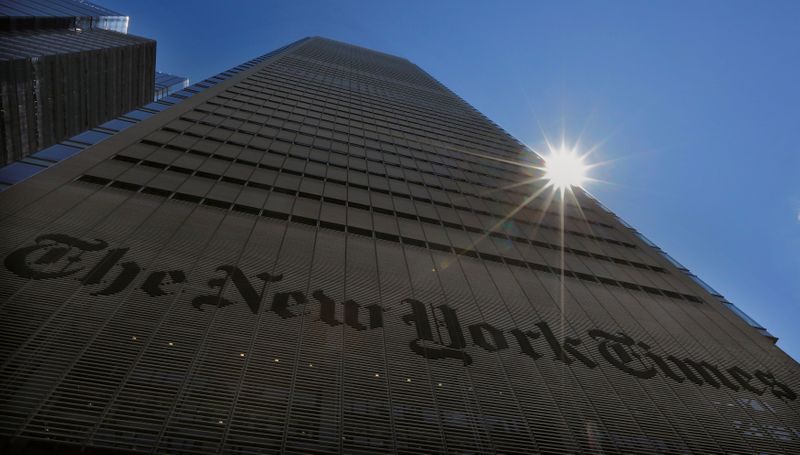 FILE PHOTO: The sun peaks over the New York Times
