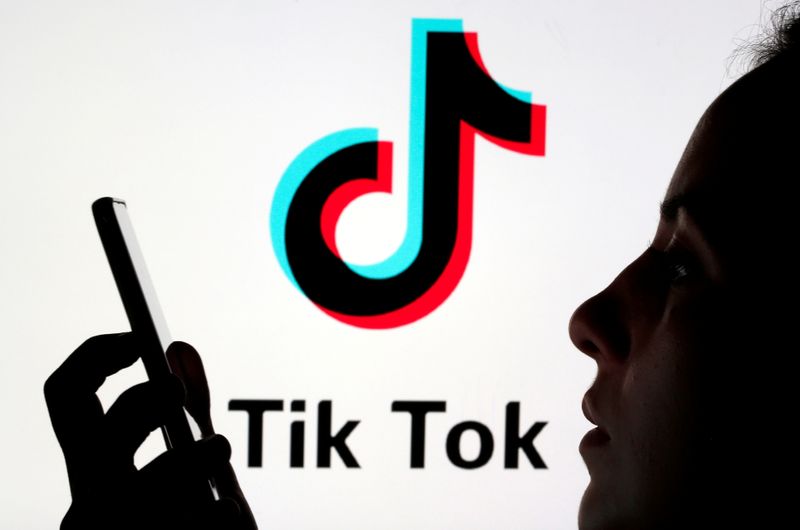 FILE PHOTO: A person holds a smartphone as Tik Tok