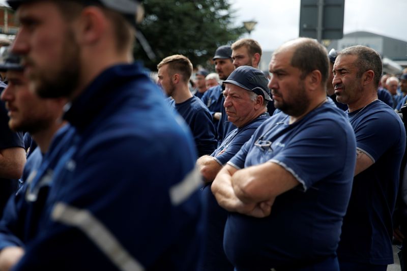 Employees attend a general meeting outside the factory of Stelia