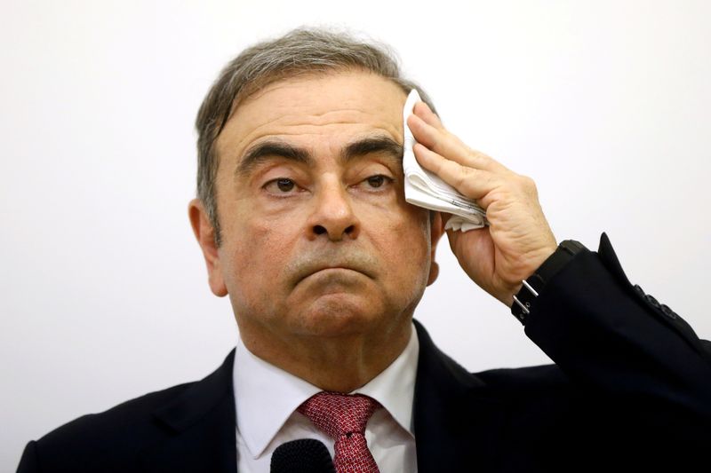 FILE PHOTO: Former Nissan chairman Carlos Ghosn attends a news