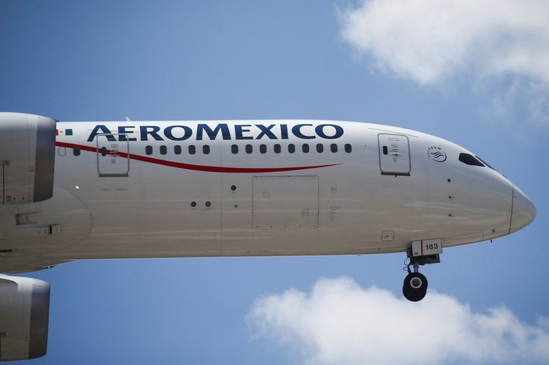 An Aeromexico airplane prepares to land on the airstrip at