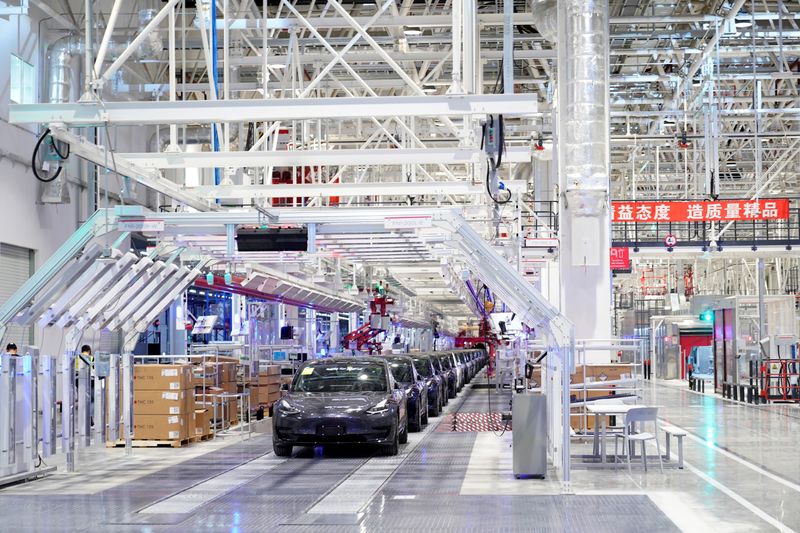 Tesla China-made Model 3 vehicles are seen during a delivery