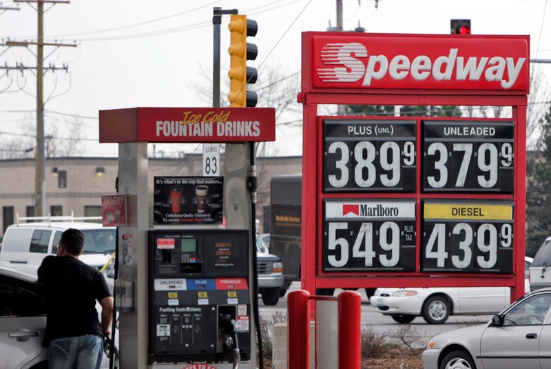 FILE PHOTO: A motorist fuels-up his car at a Speedway