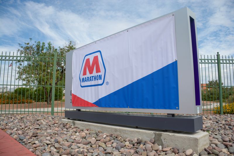 A Marathon Petroleum banner covers an Andeavor sign outside the