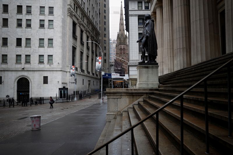 Nearly deserted Wall Street and steps of Federal Hall in