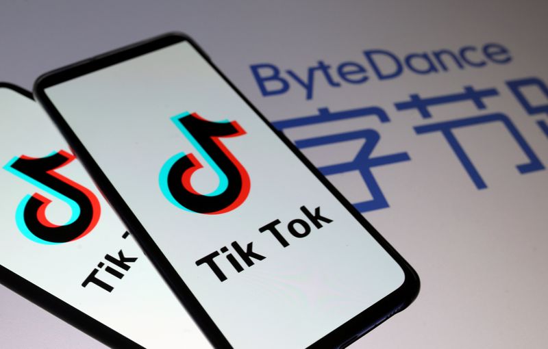 FILE PHOTO: TikTok logos are seen on smartphones in front
