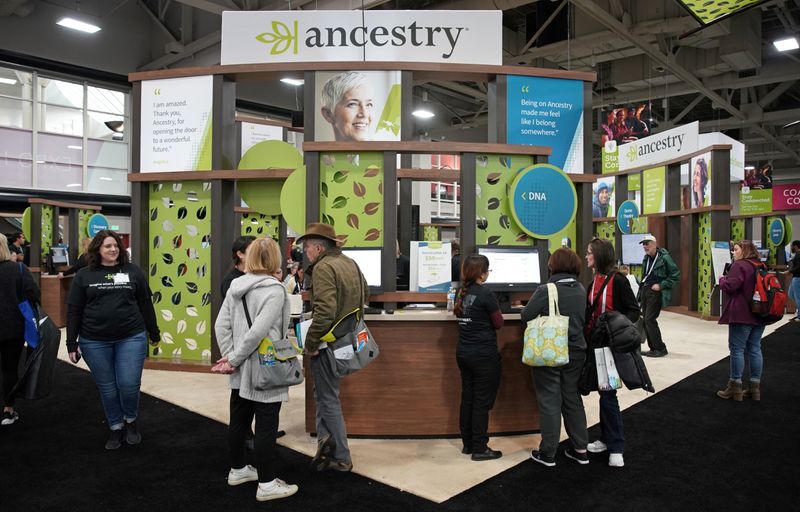 Attendees look around the Ancestry.com booth at the RootsTech annual