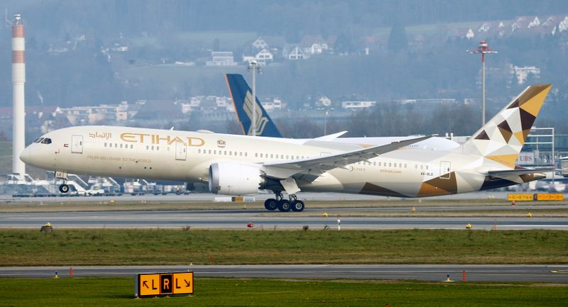 FILE PHOTO: Etihad Boeing 787 Dreamliner aircraft takes off from