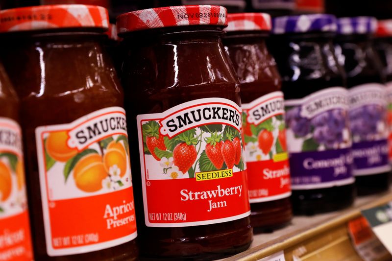 Containers of Smuckers’s Jam are displayed in a supermarket in