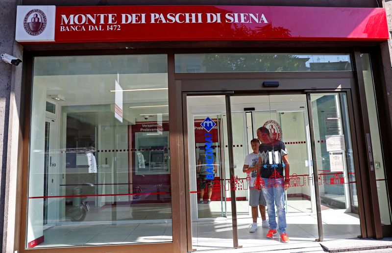 People are seen inside a Monte dei Paschi di Siena