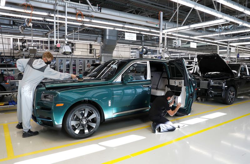 Technicians inspect a Rolls-Royce a car on the production line
