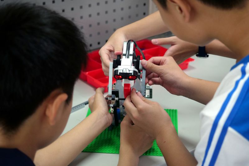 FILE PHOTO: Elementary school students build a motion sensor controlled