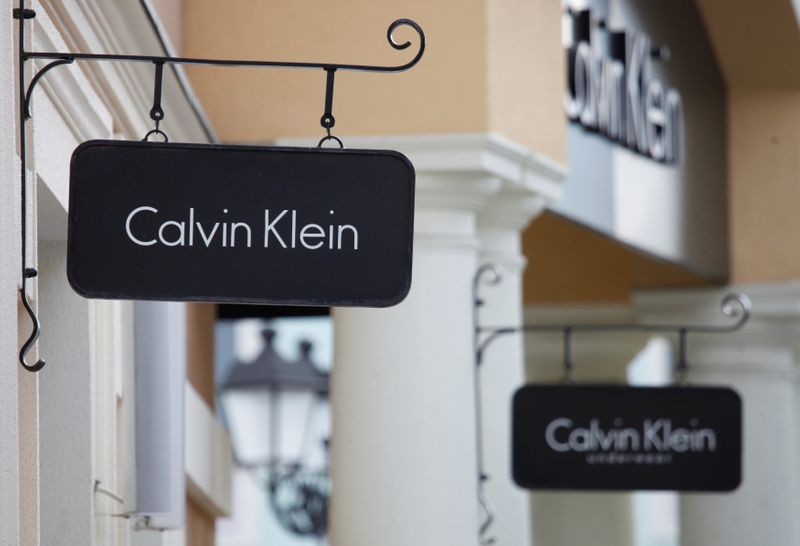 Boards with Calvin Klein store logo are seen on a