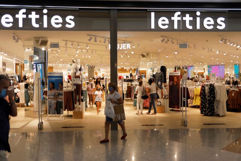A woman leaves a Lefties store, an Inditex brand, in