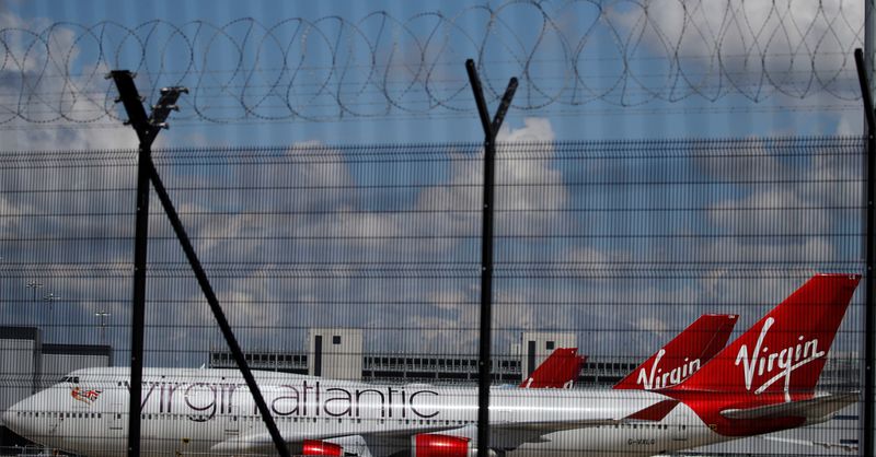 FILE PHOTO: Grounded Virgin Atlantic aircraft are seen through the