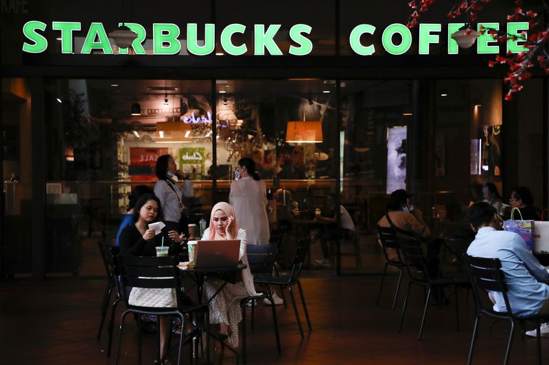 FILE PHOTO: Customers dine at a Starbucks store in Petaling
