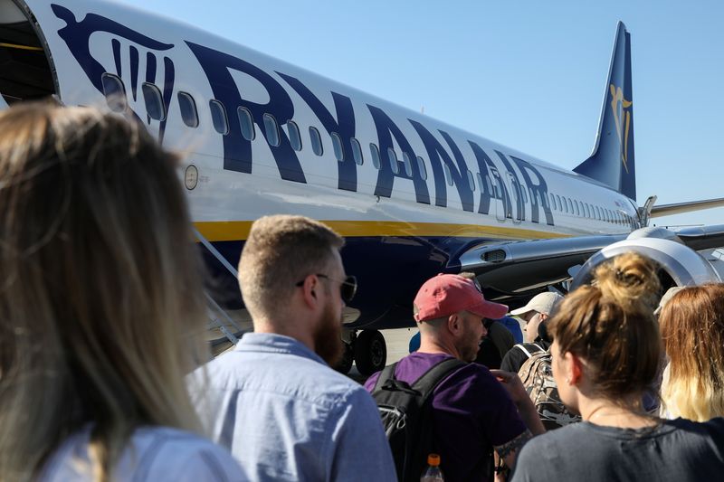 Passengers board a Ryanair flight at the airport in Gdansk