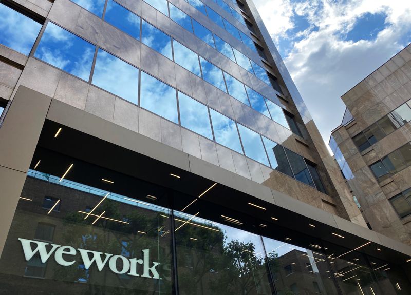 The logo of WeWork is seen in the window of
