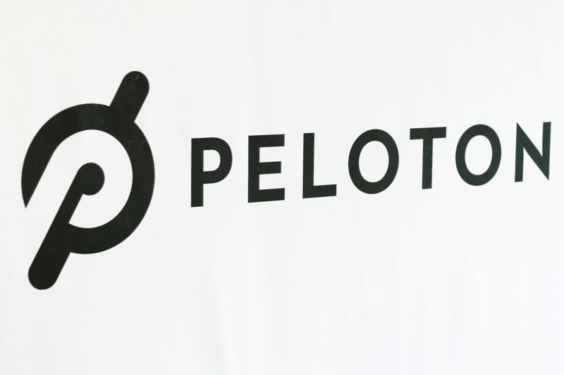 A Peloton logo is seen after the ringing of the