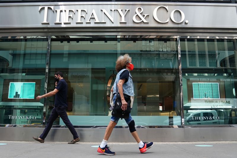 FILE PHOTO: People walk past a Tiffany & Co. store