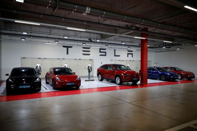 FILE PHOTO: Tesla electric vehicles for test driving are parked