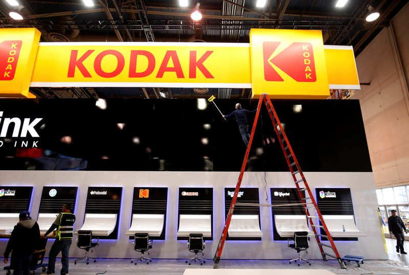 A worker cleans a Kodak booth at the Las Vegas