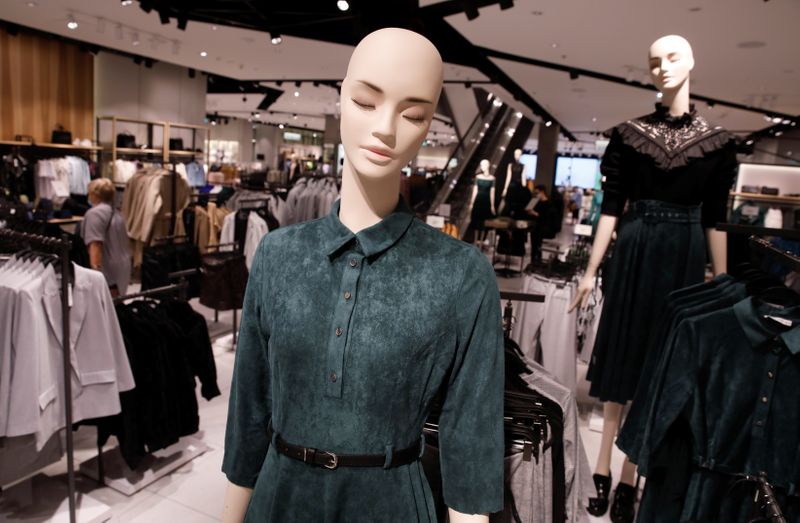 Clothes are displayed on the mannequins at Polish fashion retailer