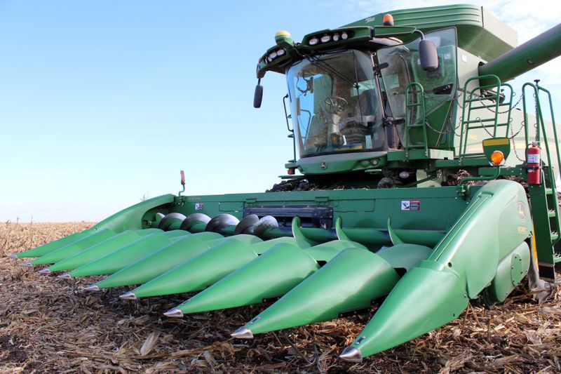 FILE PHOTO: A farmer’s corn harvesting combine is seen during