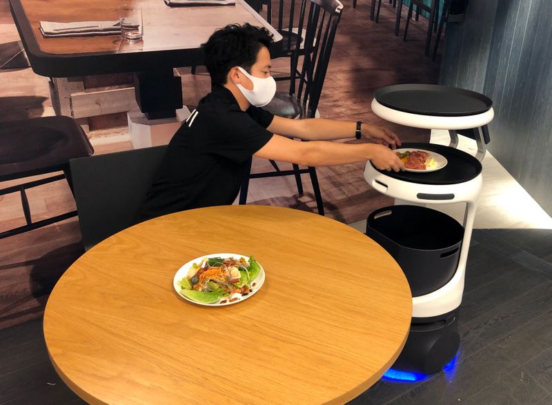 SoftBank’s robotics arm demonstrates a food service robot Servi, developed