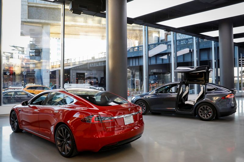 Tesla Motors’ cars are displayed at the company’s new showroom