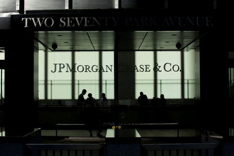 FILE PHOTO: People walk inside JP Morgan headquarters in New