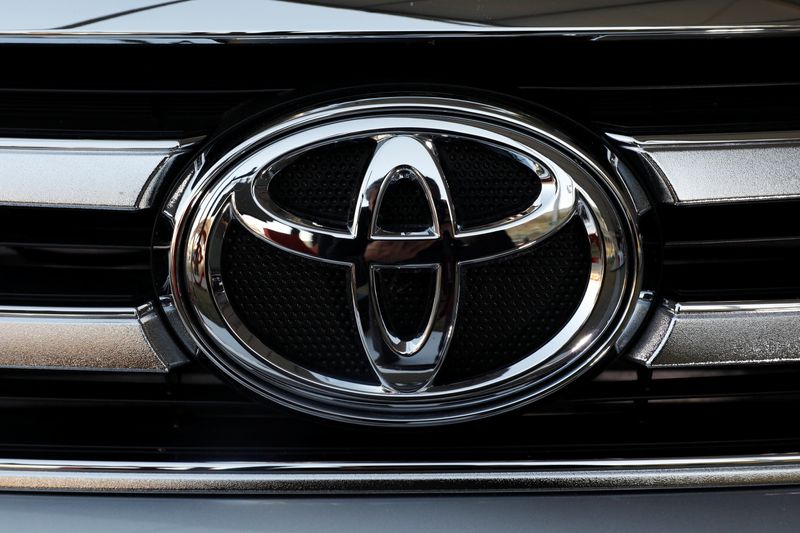A Toyota Motor Corp. logo is seen on a car