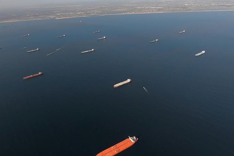Some of the 27 oil tankers anchored viewed by helicopter